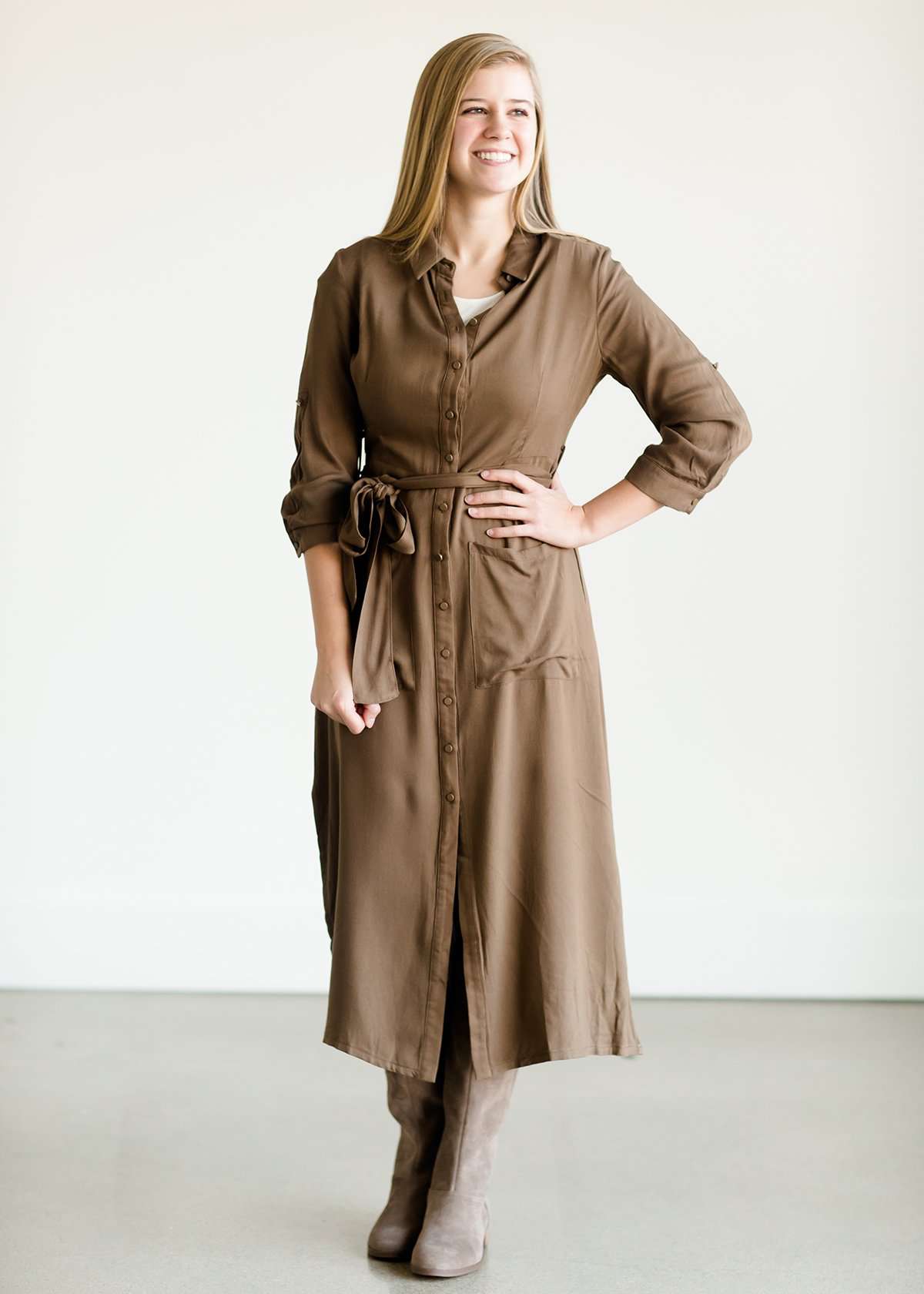 Olive colored belted midi dress with buttons running down the front.