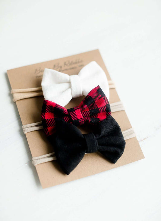 Buffalo check headbands that are white, red and black. Nylon headband or a alligator style clip.