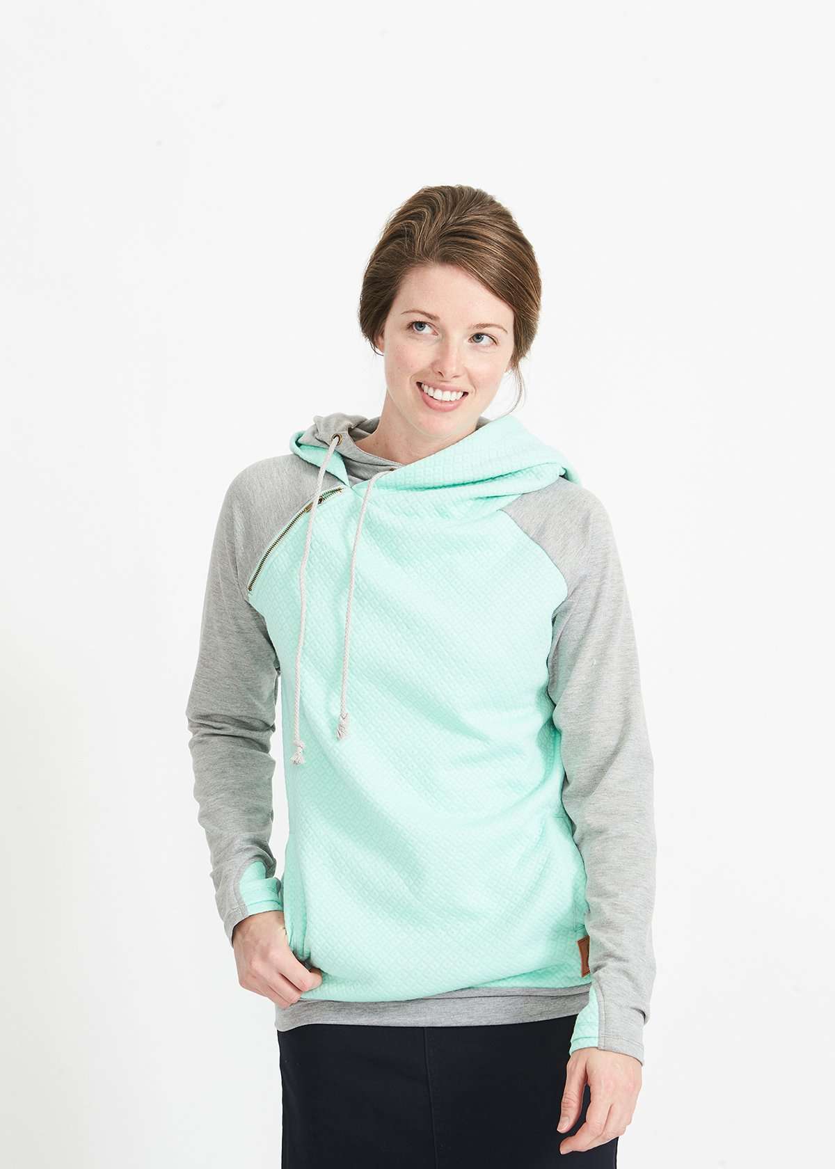 Woman wearing a mint and gray doublehood sweatshirt from ampersand avenue