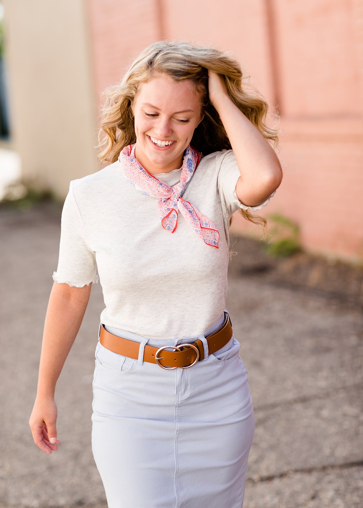 woman wearing a gray mock neck short sleeve top