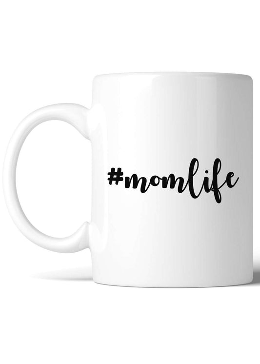 white ceramic mug with #momlife on it