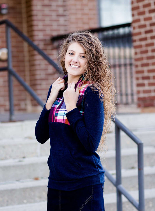 This half zip pullover features a front pouch pocket and a beautiful color block print of fuchsia, teal and mustard! It also is a mommy and me style.  