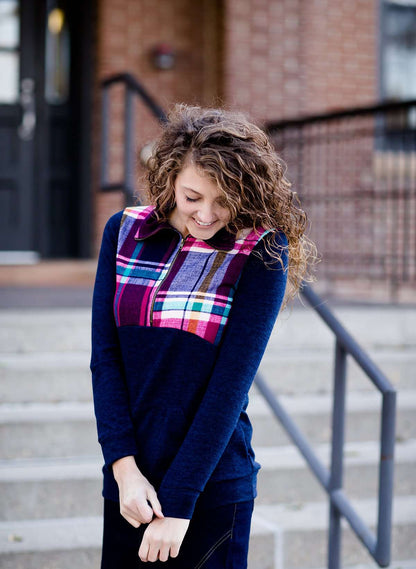 This half zip pullover features a front pouch pocket and a beautiful color block print of fuchsia, teal and mustard! It also is a mommy and me style.  