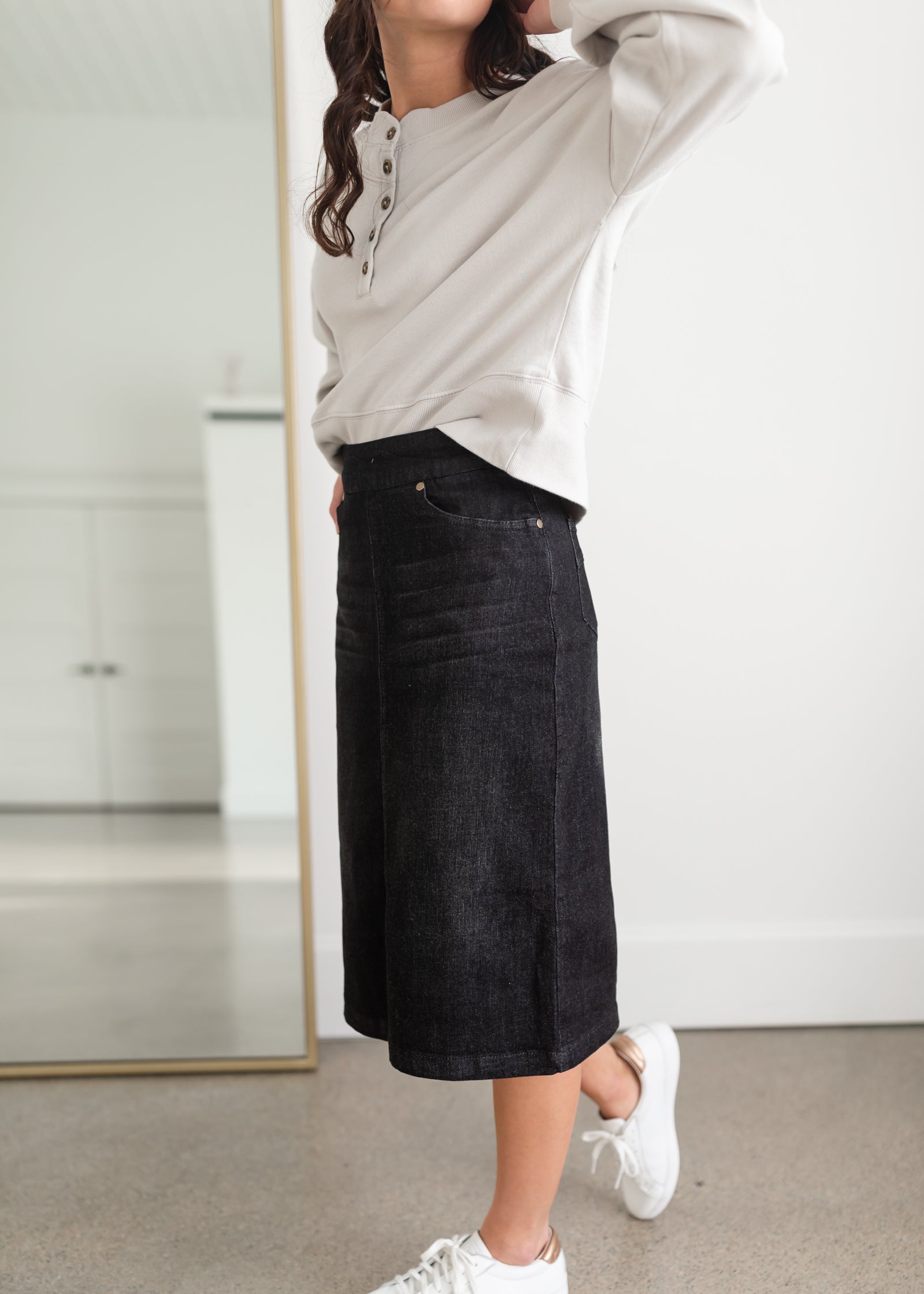 Sandra Black Midi Skirt Inherit Co. Sandra Black Midi Skirt Inherit Co. is a pull on stretch denim in black wash.